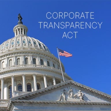 government building with blue sky and the text corporate transparency act across the sky