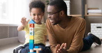 dad and son playing