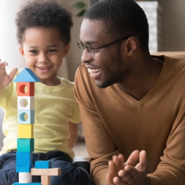 dad and son playing